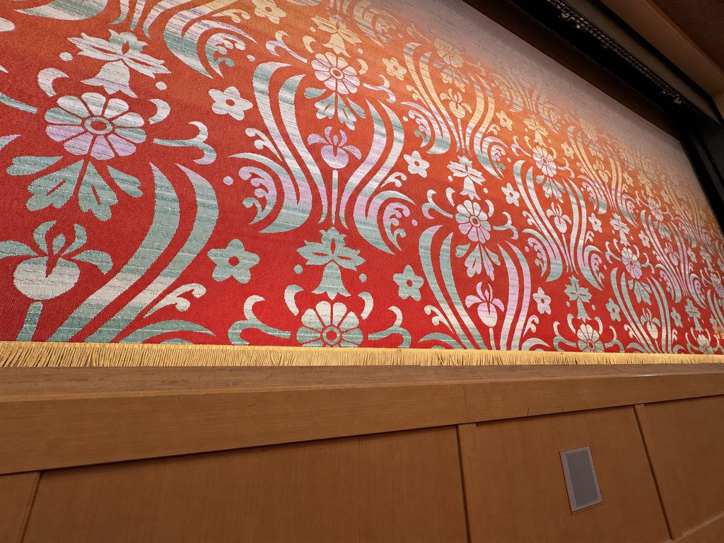 Close-up of the woven floral stage curtain at Minamiza Theatre